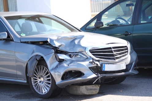A luxury Mercedes-Benz is damaged during a car accident