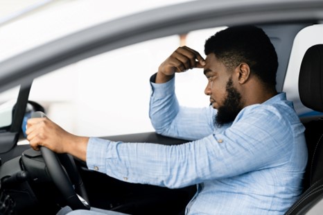 Dispairing man wonders how he will sell his damaged car